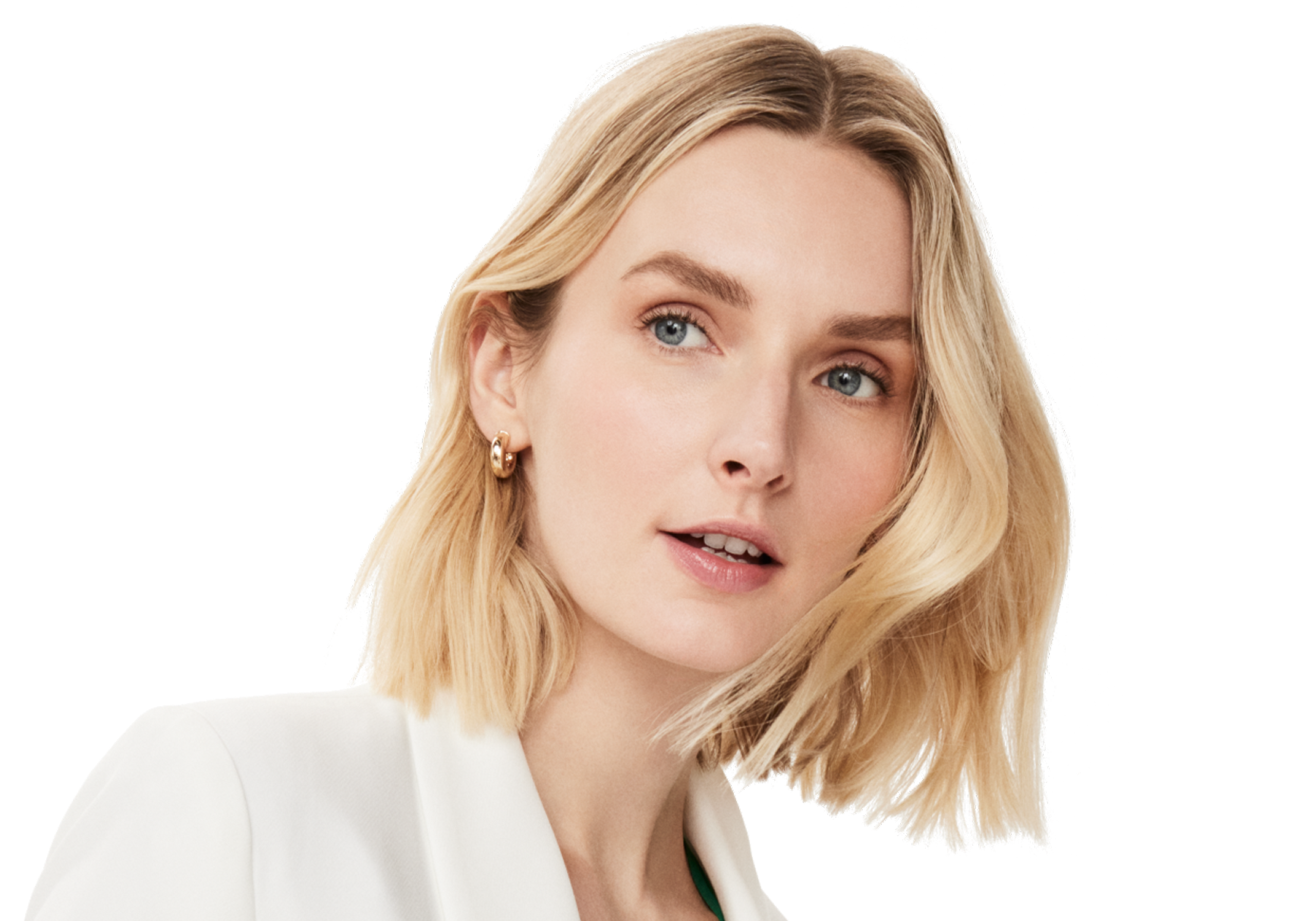Image of a woman with blonde hair, wearing earrings and a white blazer, gazing sideways with a slight smile.