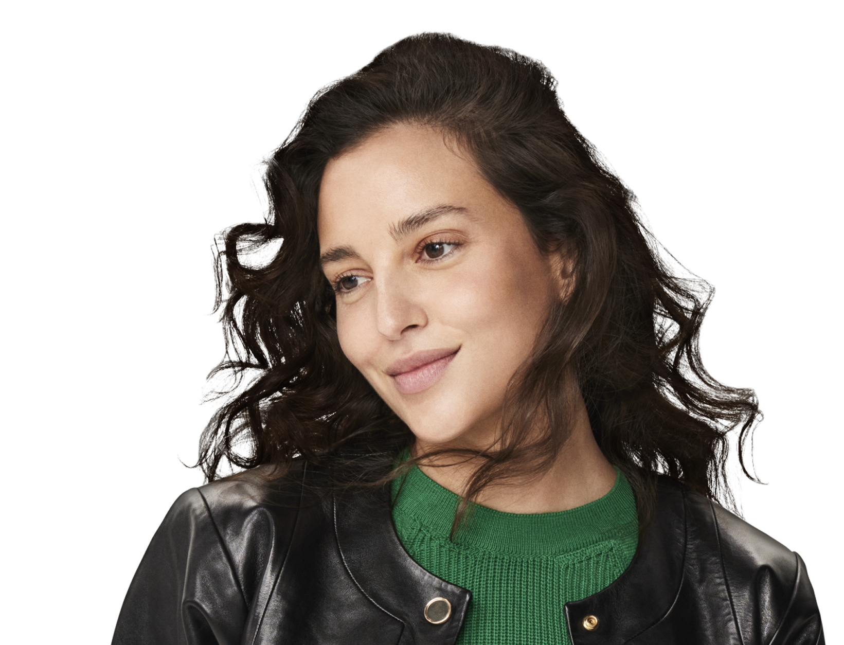 Curly-haired woman in a black leather jacket, tilting her head slightly and looking at the camera with a soft expression.